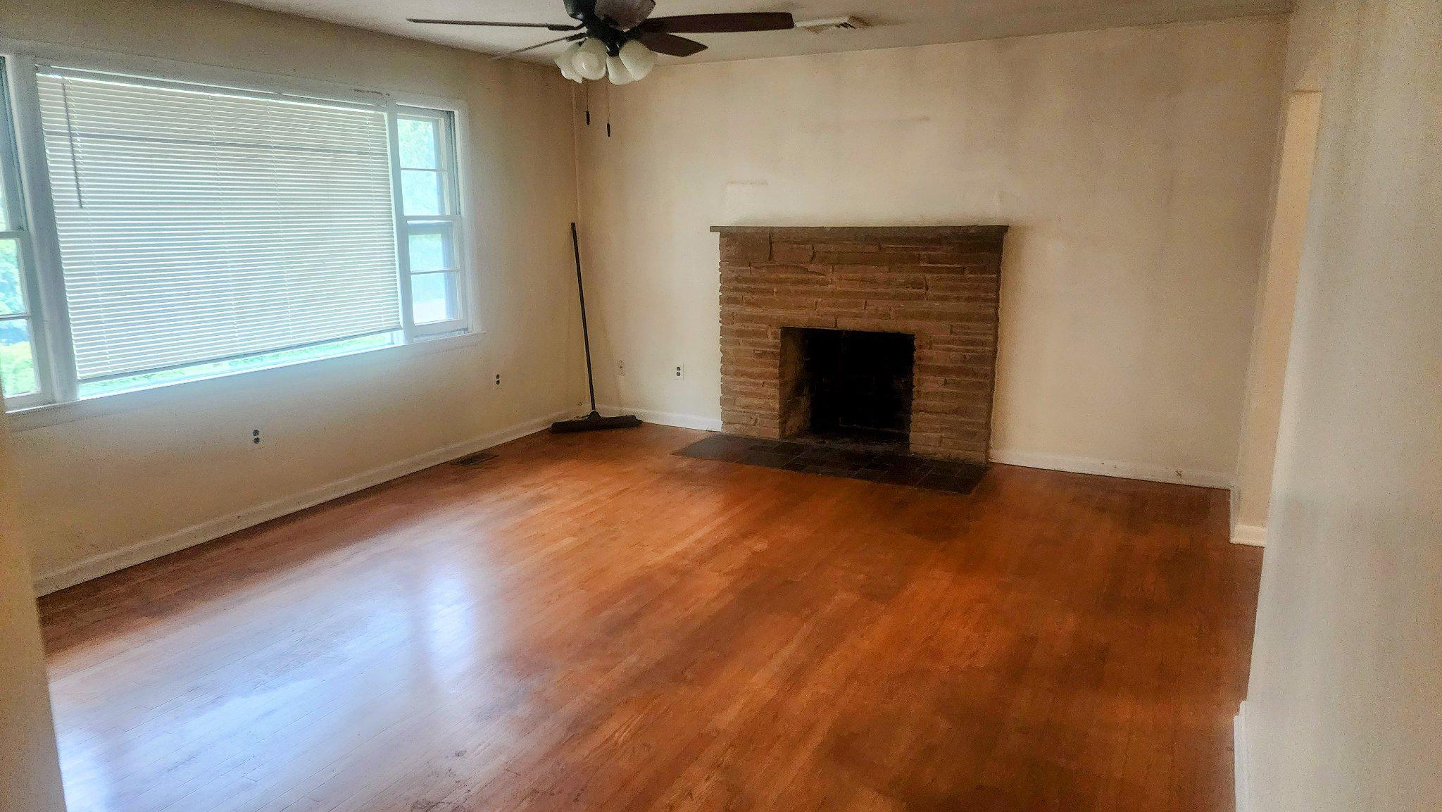 7612 Moores Road Brandywine, MD 20613 - Photo 3 of 15 Spacious living area with fireplace.