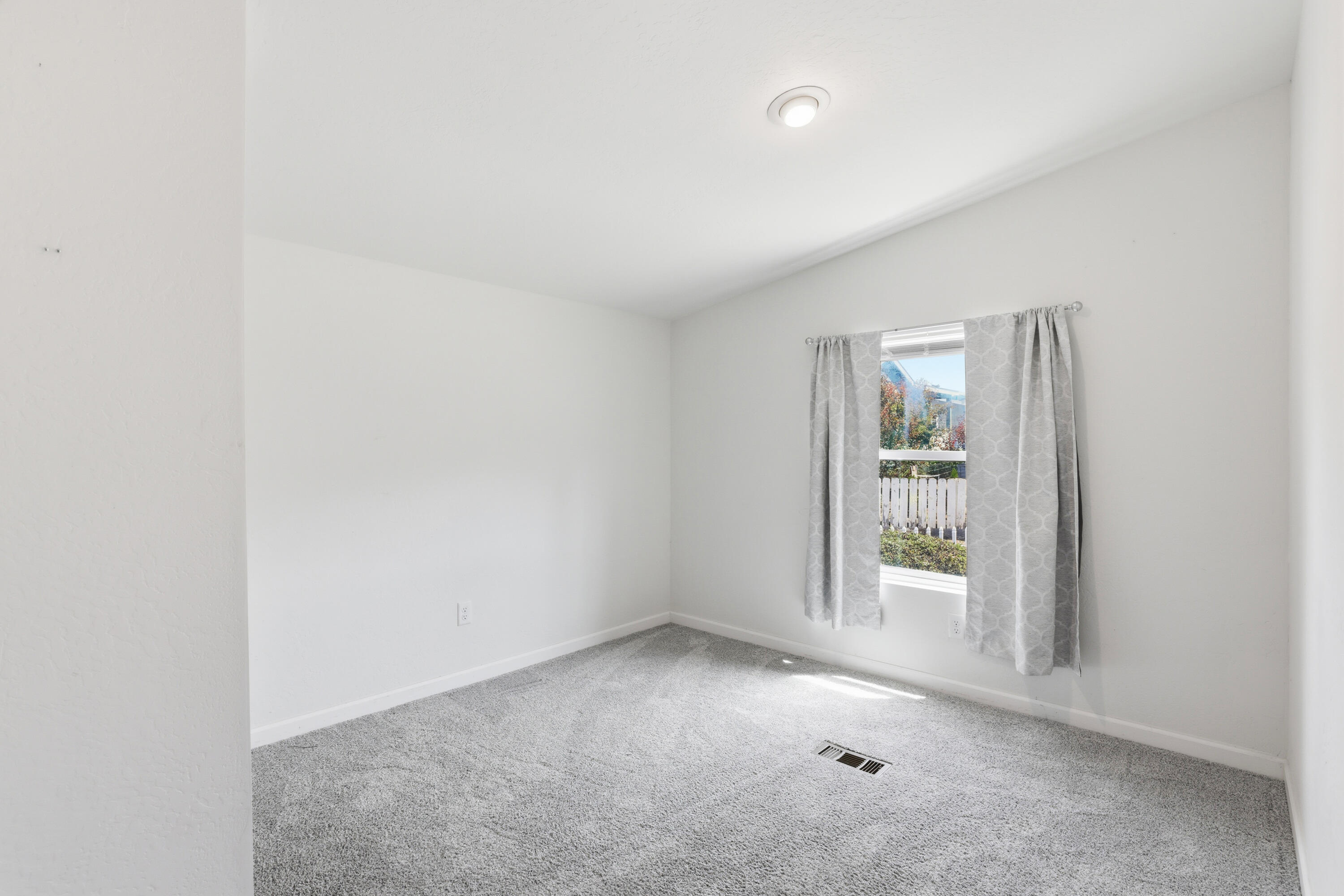 8401 Old Stage Road, Unit 16 Central Point, OR 97502 - Photo 17 of 23 an empty room with windows
