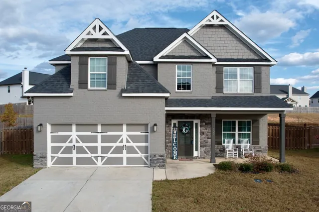 front view of a house with a yard