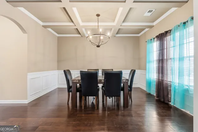 a view of a dining room with furniture window and wooden floor
