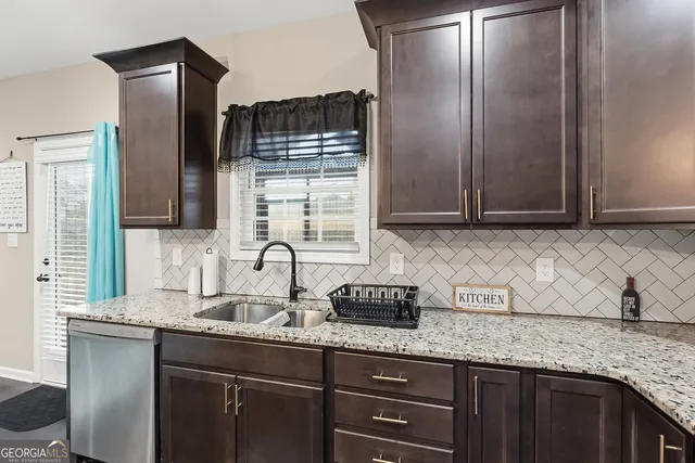 a spacious bedroom with a bed and ceiling fan
