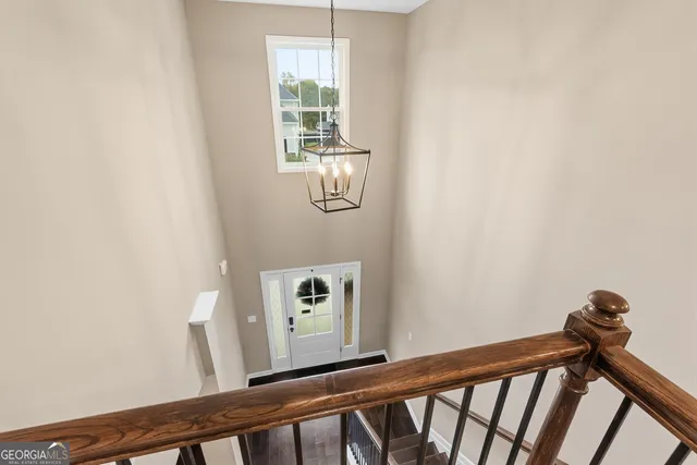 a bathroom with double vanity sinks and a mirror