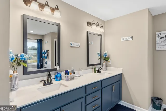 a bathroom with a glass shower door