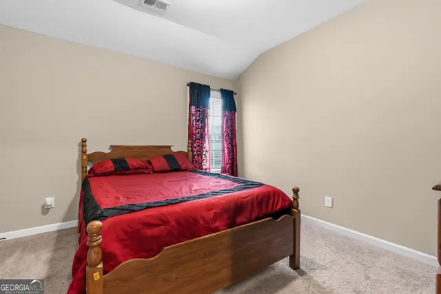 a living room with furniture a fireplace and windows