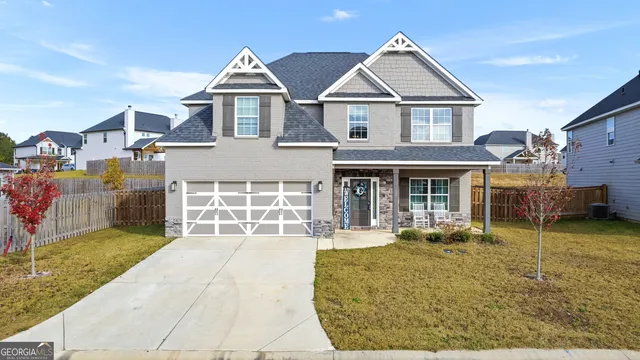front view of a house with a yard