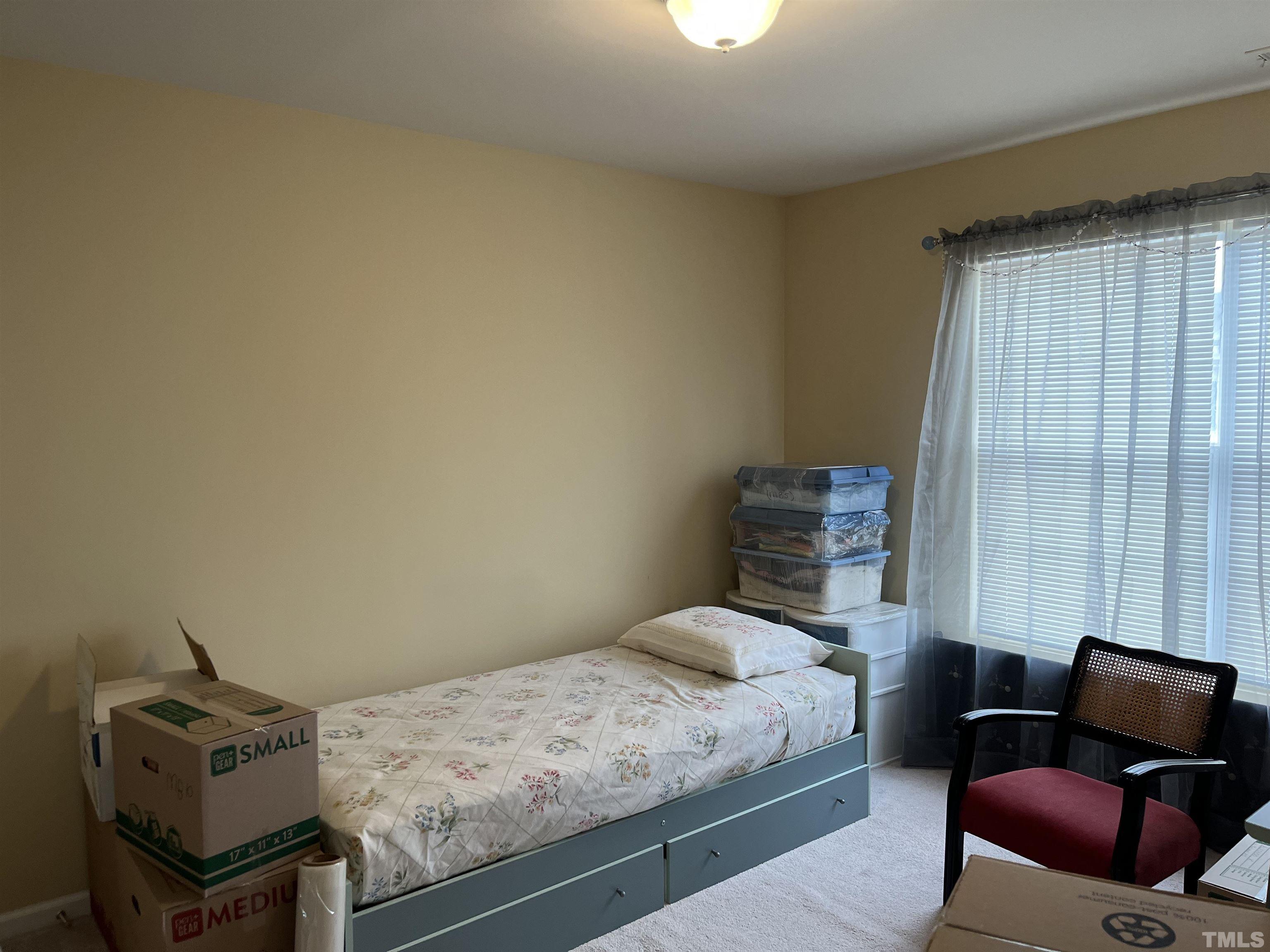 5309 Glen Canyon Road Raleigh, NC 27616 - Photo 11 of 11 a bedroom with a bed and wooden floor