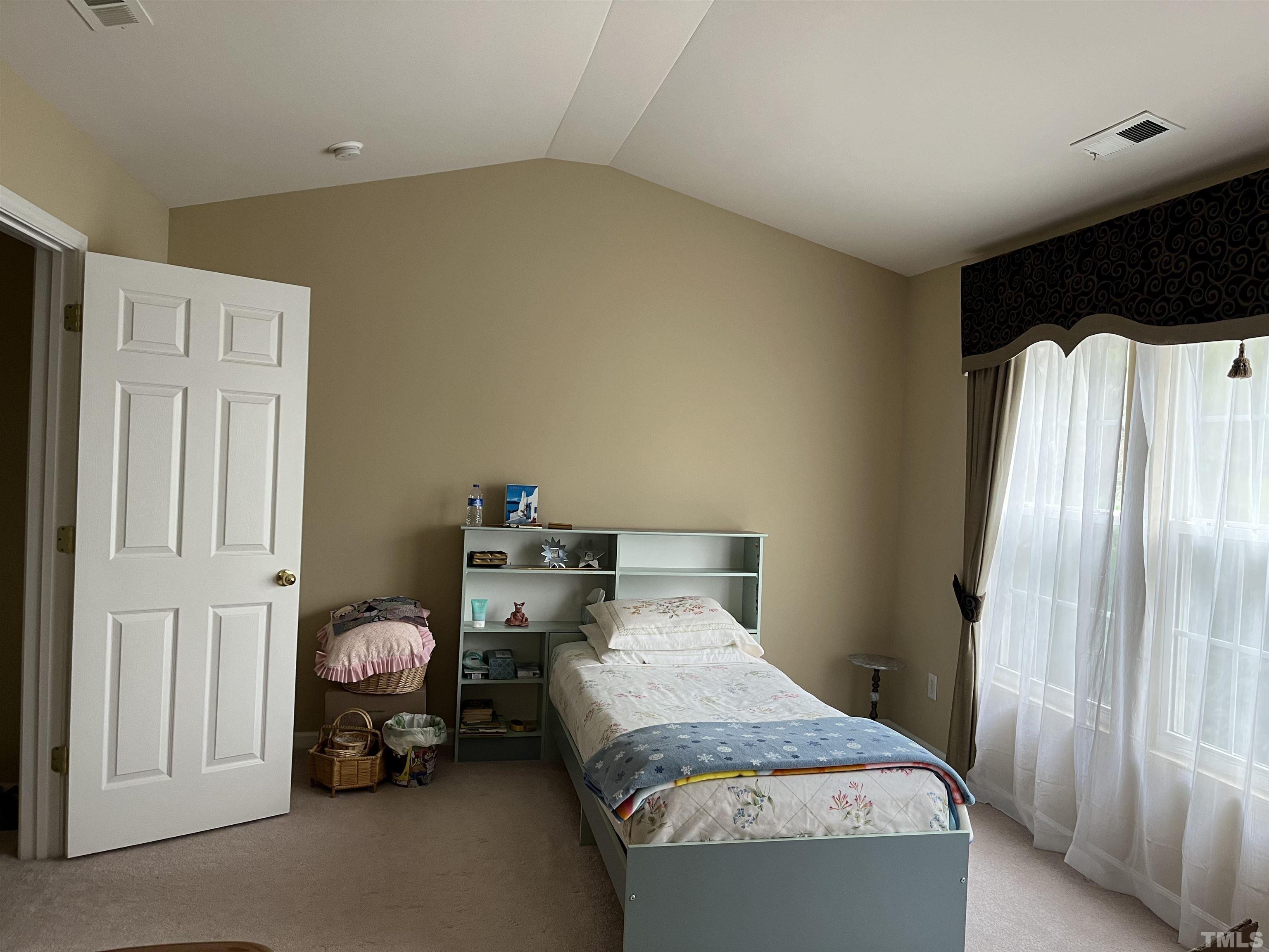 5309 Glen Canyon Road Raleigh, NC 27616 - Photo 10 of 11 a bedroom with bed and window