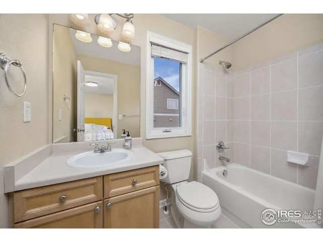 a bedroom with a bed and a desk