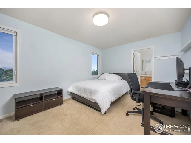 a kitchen with a sink a counter top space cabinets and stainless steel appliances