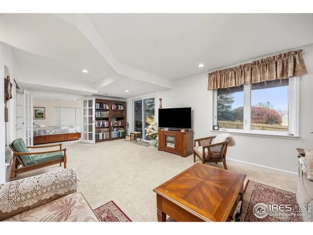 a living room with furniture flat screen tv and a fireplace