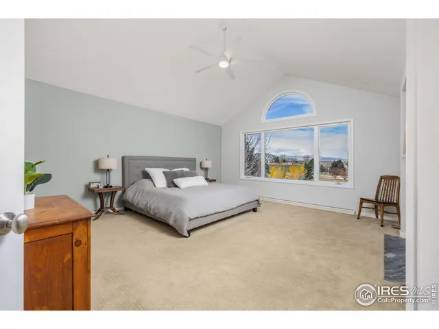 a bedroom with a bed and a table in it