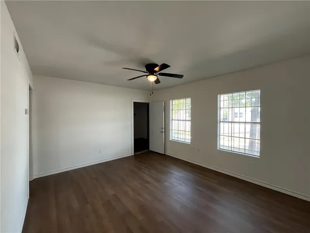 a view of an empty room with a window