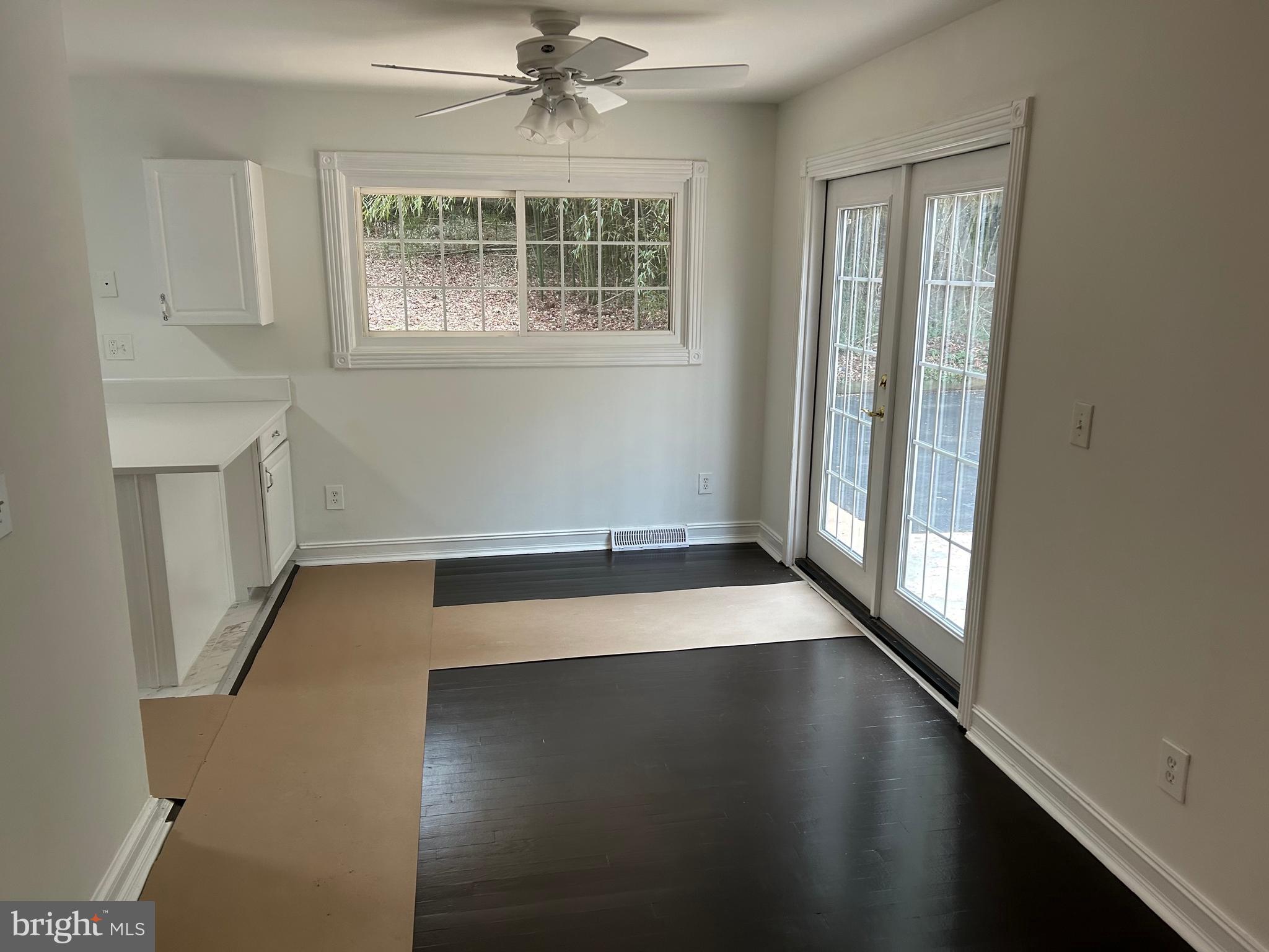 1350 Ritchie Highway Arnold, MD 21012 - Photo 12 of 30 an empty room with wooden floor and windows
