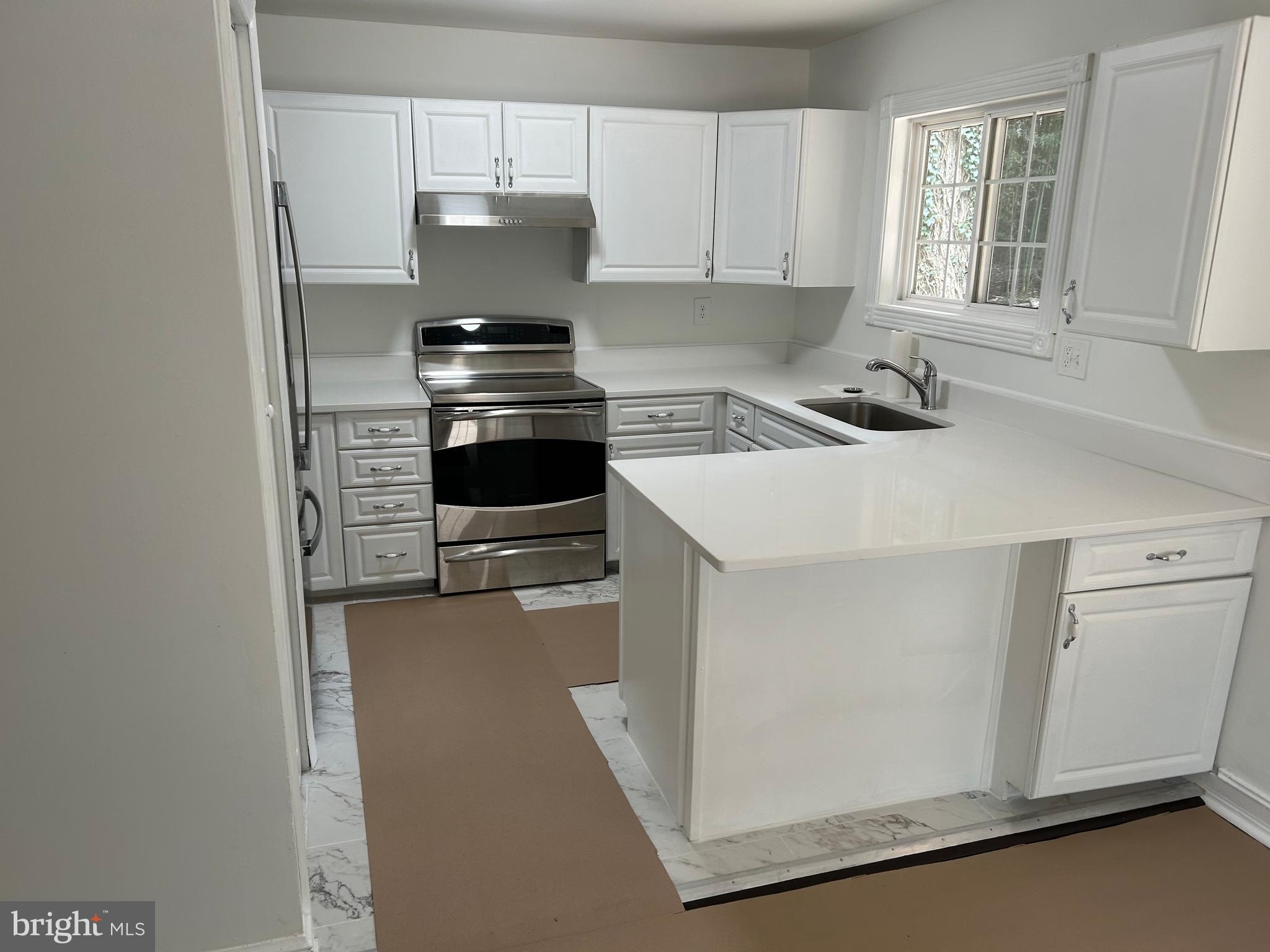 1350 Ritchie Highway Arnold, MD 21012 - Photo 13 of 30 a kitchen with a stove and a microwave