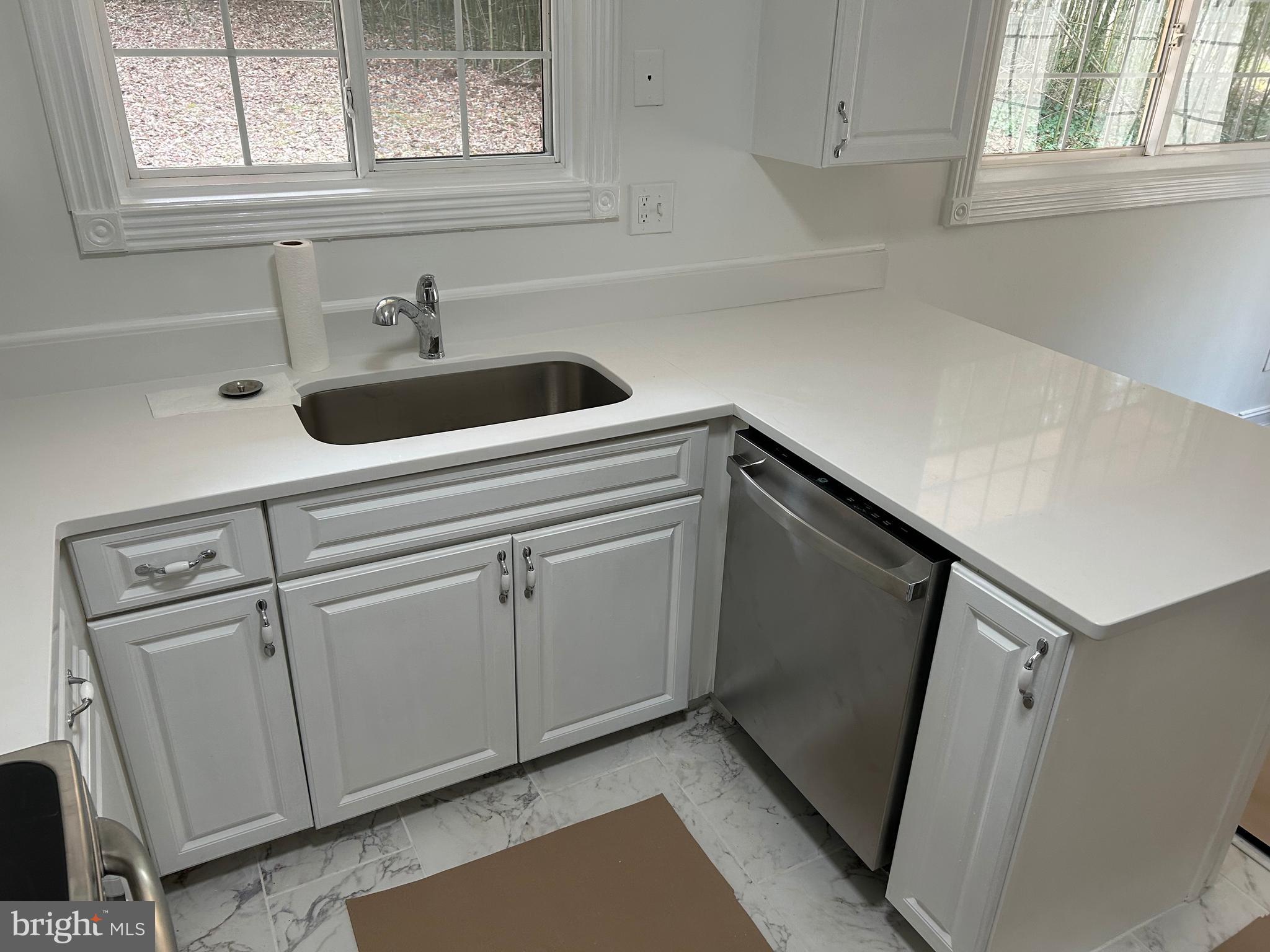1350 Ritchie Highway Arnold, MD 21012 - Photo 14 of 30 a kitchen with a sink and cabinets