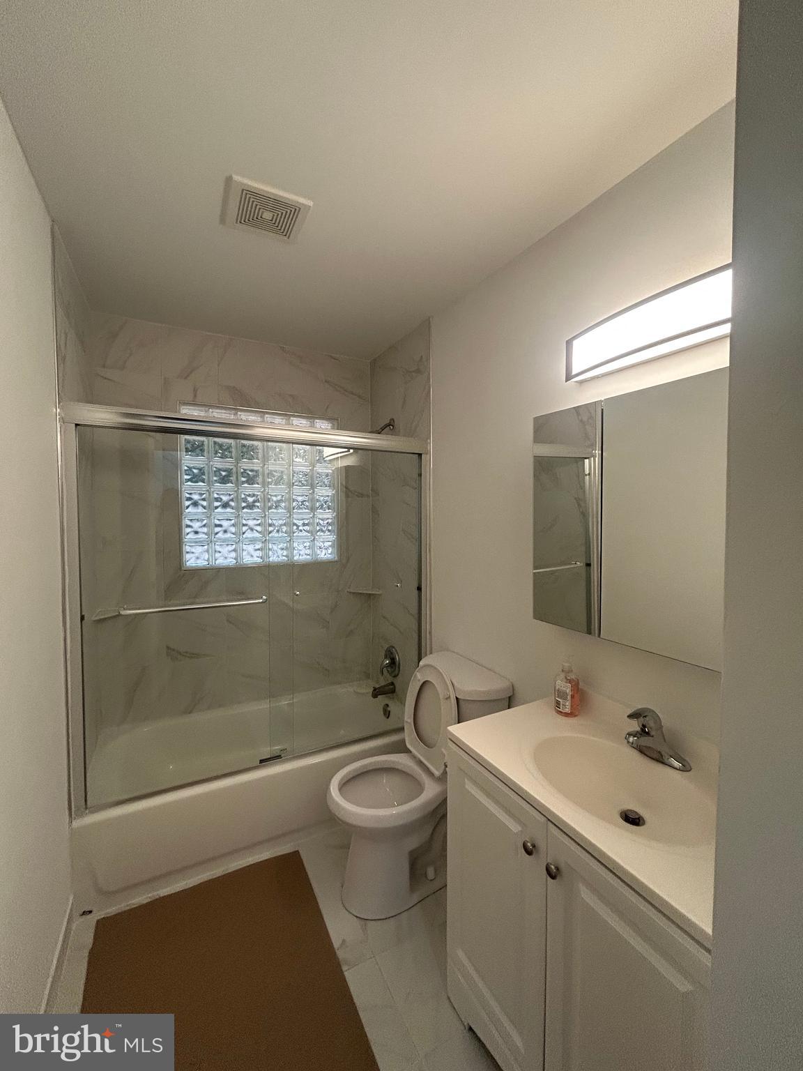 1350 Ritchie Highway Arnold, MD 21012 - Photo 17 of 30 a bathroom with a sink a toilet and shower