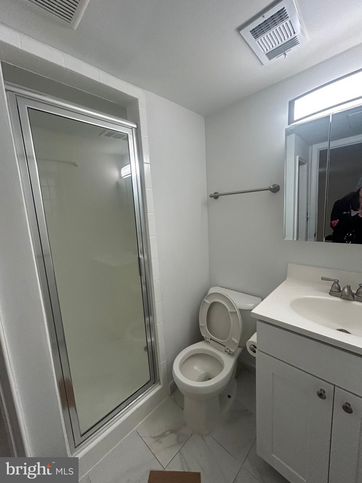 1350 Ritchie Highway Arnold, MD 21012 - Photo 27 of 30 a bathroom with a toilet a sink and a mirror