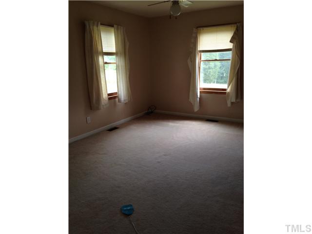 3074 Virgilina Road Roxboro, NC 27574 - Photo 6 of 12 a view of an empty room with a window