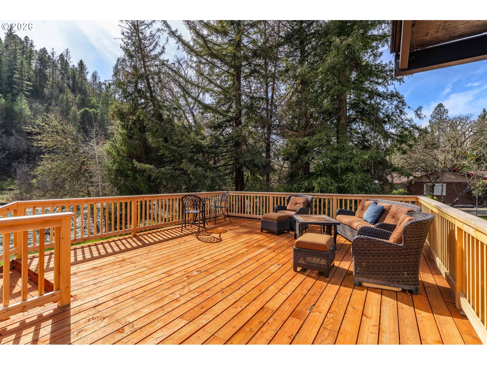 24990 Highway 62 Trail, OR 97541 - Photo 11 of 23 a balcony with wooden floor and furniture