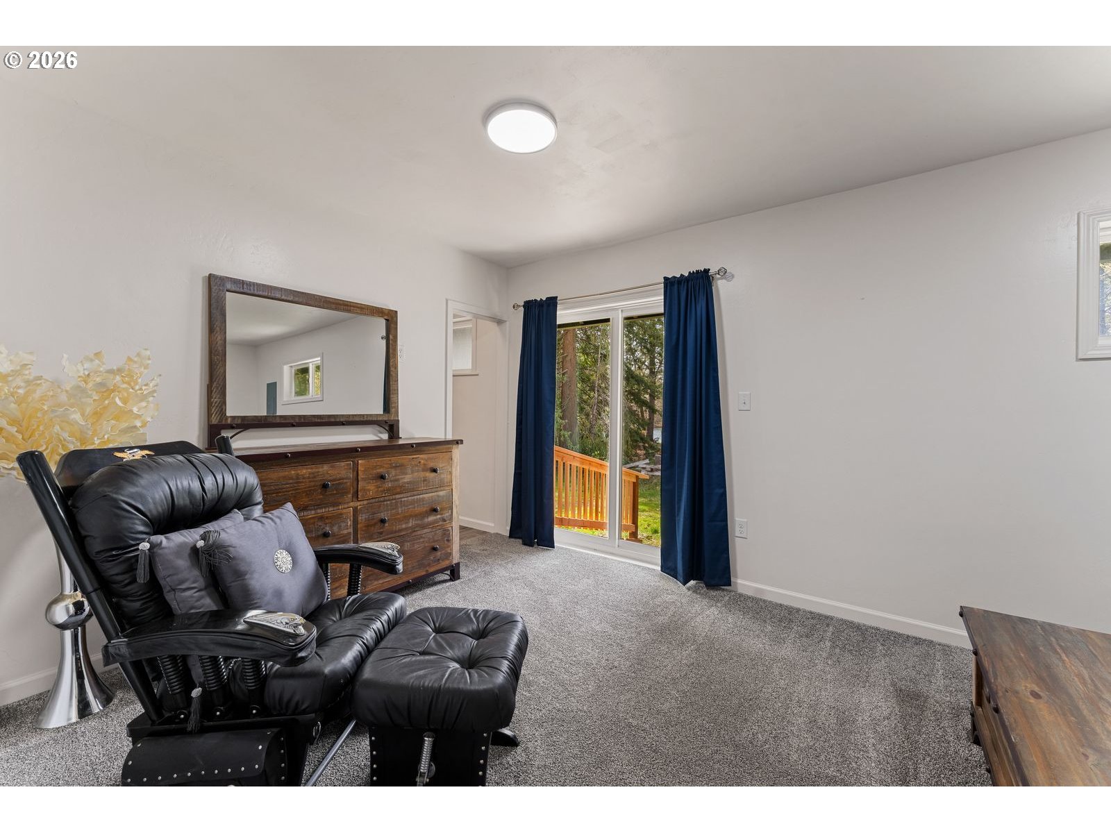 24990 Highway 62 Trail, OR 97541 - Photo 15 of 23 a living room with furniture and a flat screen tv