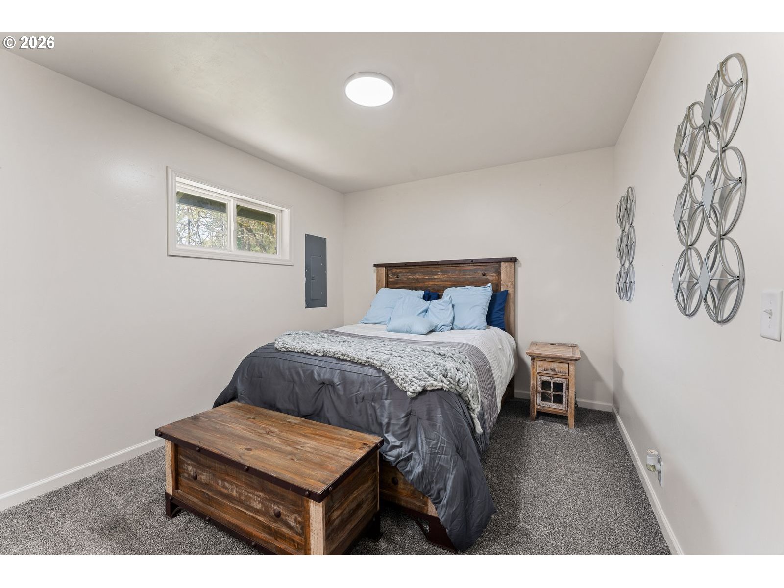 24990 Highway 62 Trail, OR 97541 - Photo 16 of 23 a bedroom with a bed and a wall painting