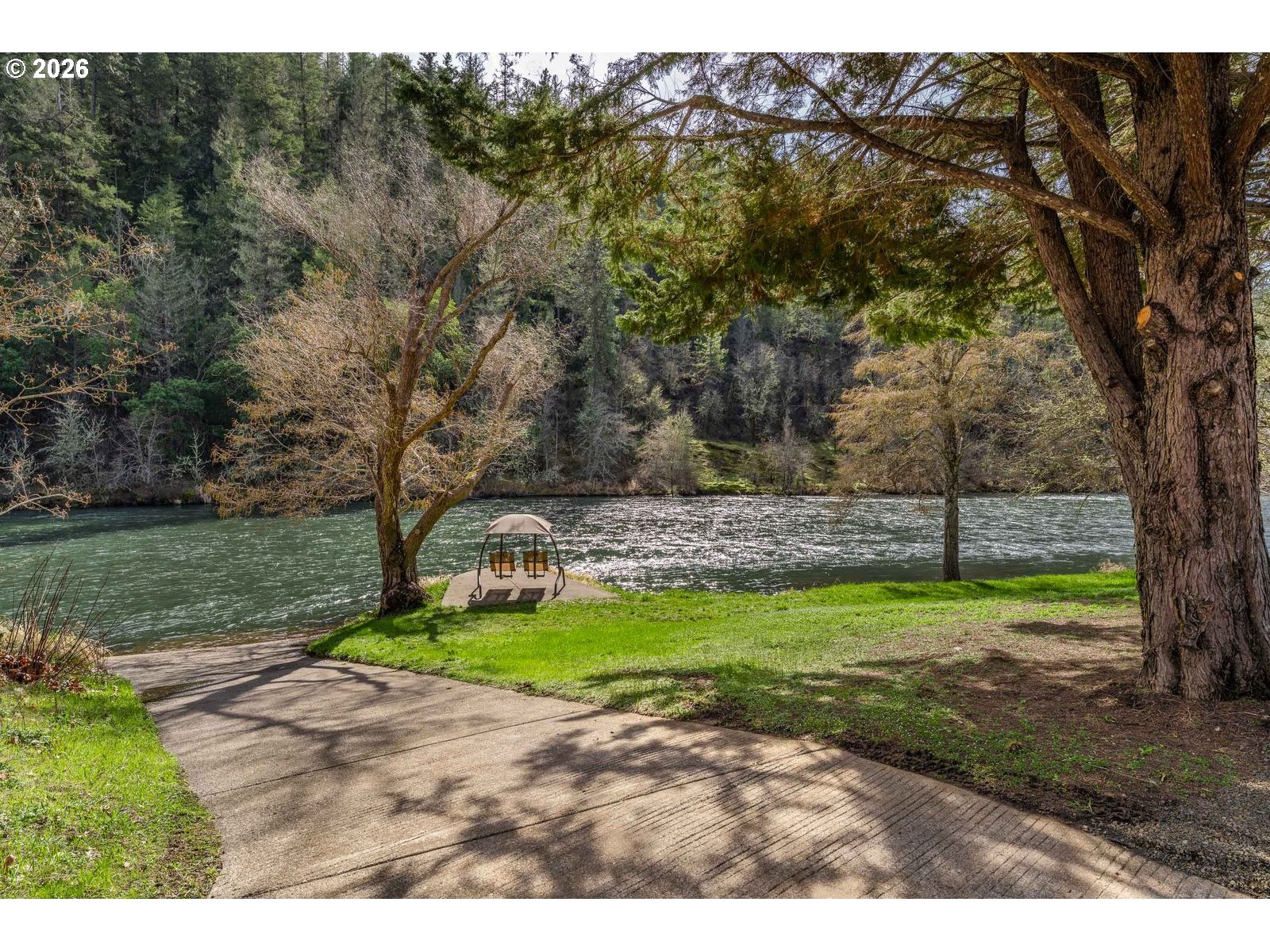24990 Highway 62 Trail, OR 97541 - Photo 2 of 23 a view of a backyard with large trees