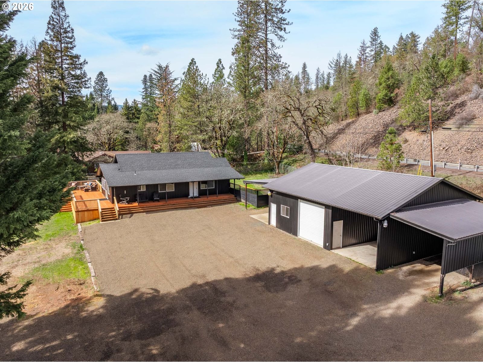 24990 Highway 62 Trail, OR 97541 - Photo 4 of 23 a view of a house with a yard and sitting area