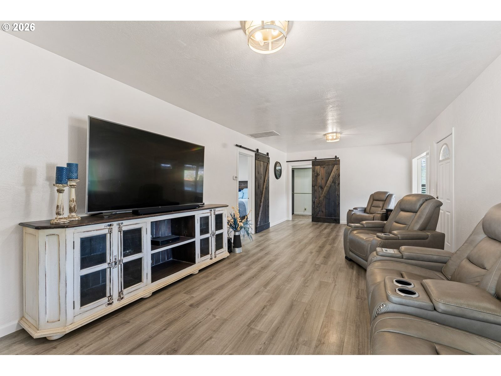 24990 Highway 62 Trail, OR 97541 - Photo 5 of 23 a living room with furniture and a flat screen tv