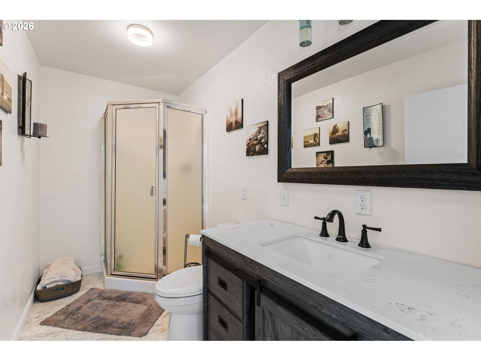 24990 Highway 62 Trail, OR 97541 - Photo 7 of 23 a bathroom with a sink a toilet and mirror