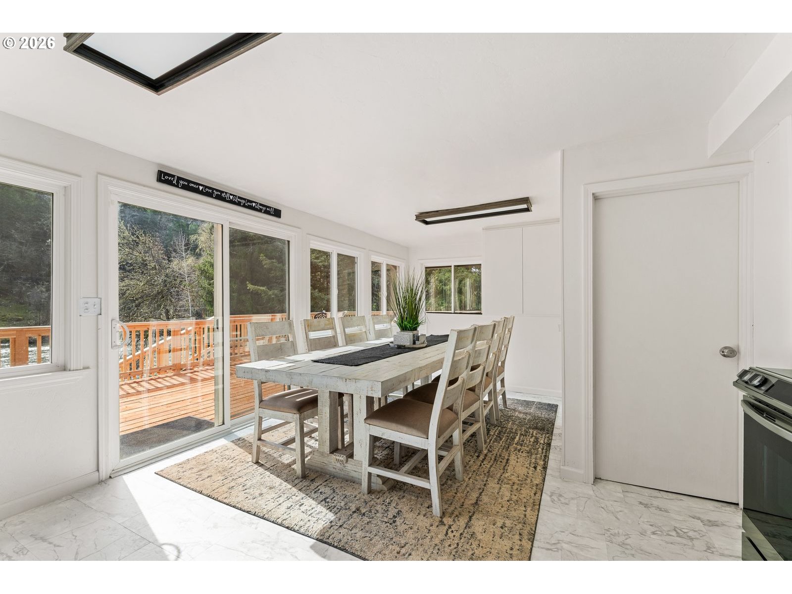 24990 Highway 62 Trail, OR 97541 - Photo 10 of 23 a view of a dining room with furniture and wooden floor
