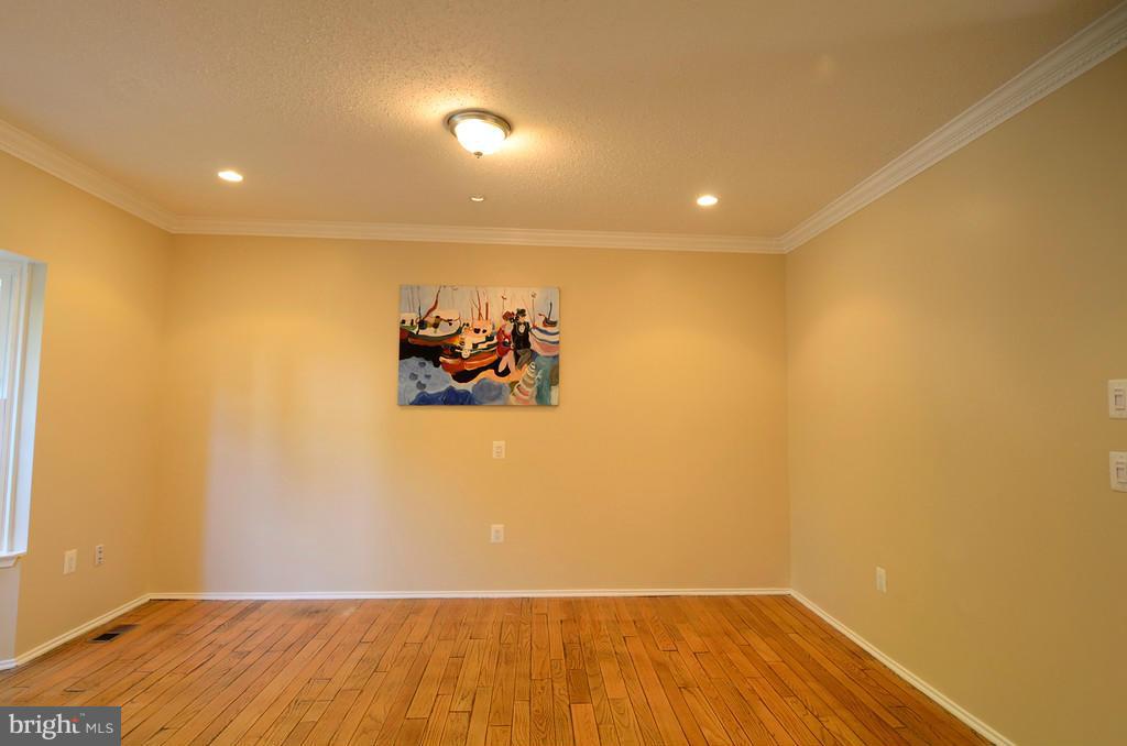 2330 Hunters Square Court Reston, VA 20191 - Photo 2 of 30 a view of a room with wooden floor