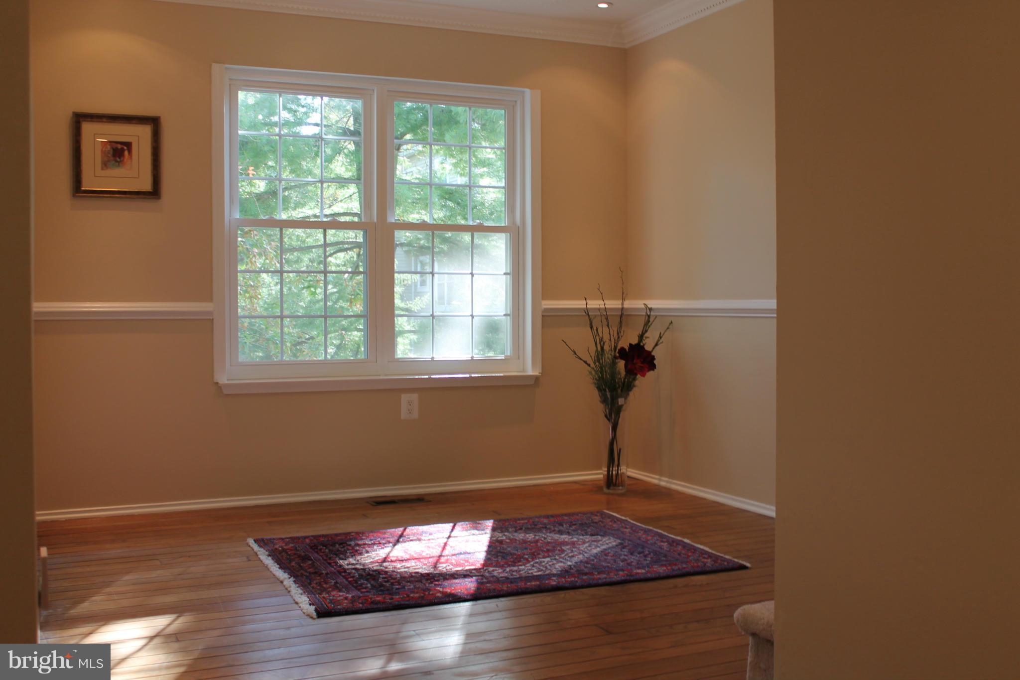 2330 Hunters Square Court Reston, VA 20191 - Photo 8 of 30 a view of a room with wooden floor and a window