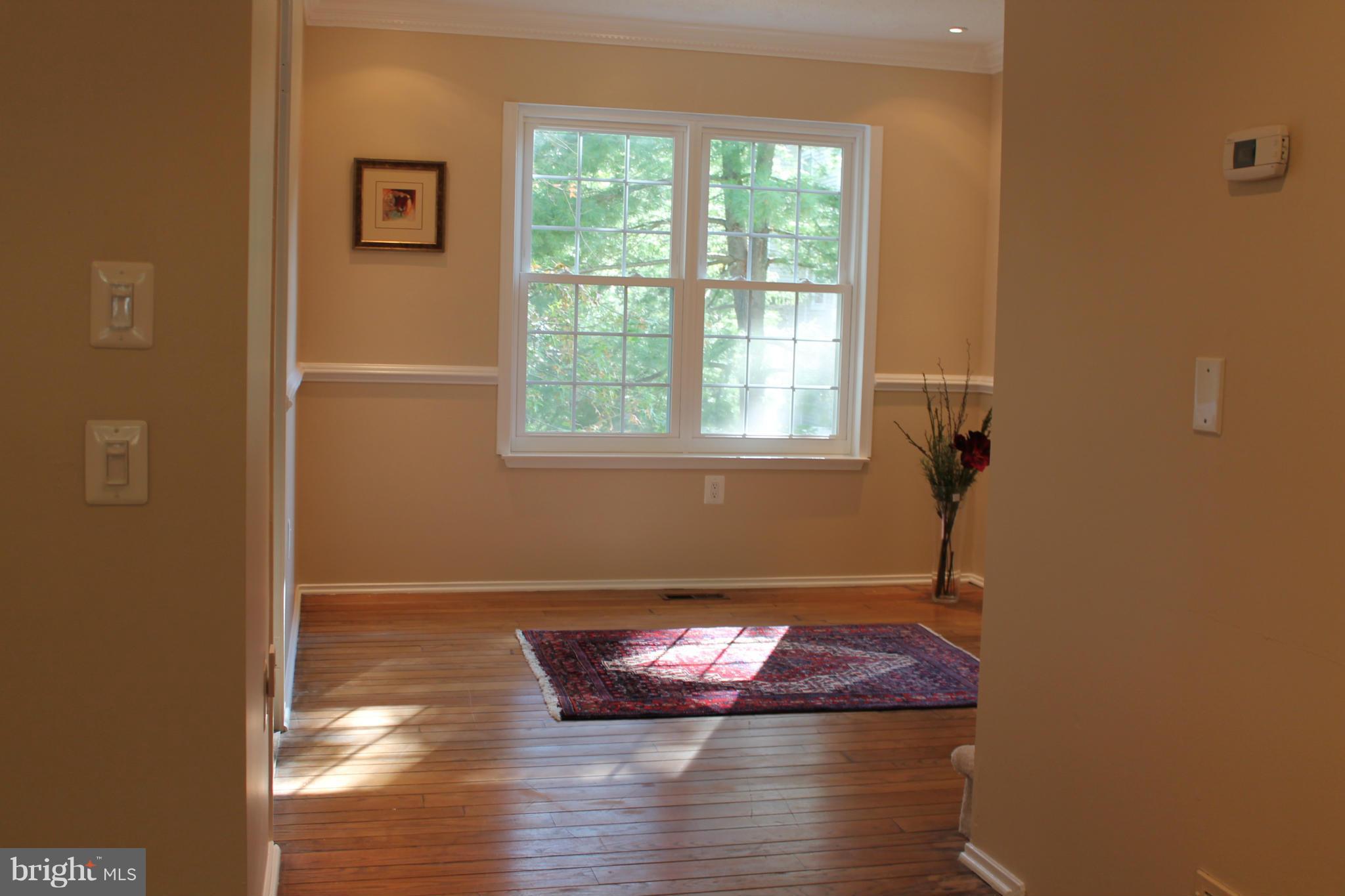 2330 Hunters Square Court Reston, VA 20191 - Photo 9 of 30 a room with window wooden floor