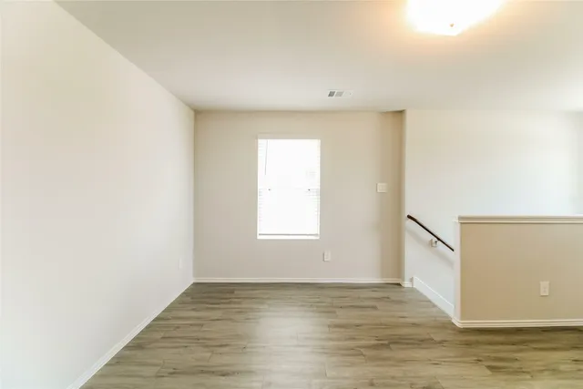 a view of an empty room and window
