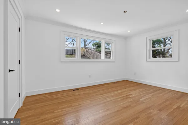 a view of room with wooden floor and window