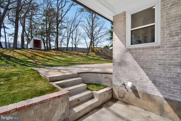 a view of backyard with outdoor seating