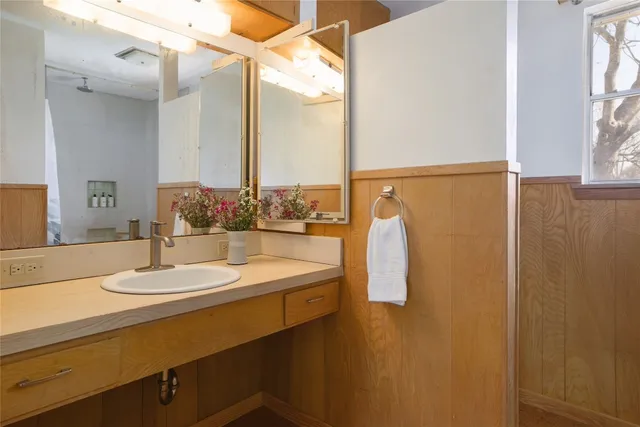 a bathroom with a bathtub and shower