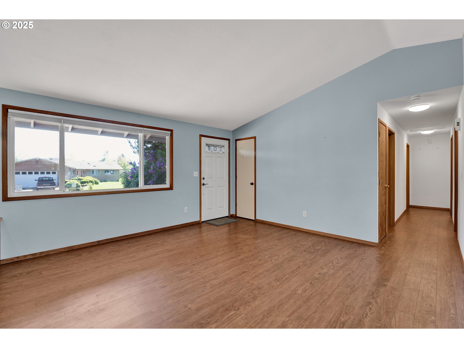 3760 Cherokee Drive Springfield, OR 97478 - Photo 11 of 42 a view of an empty room with wooden floor and a window
