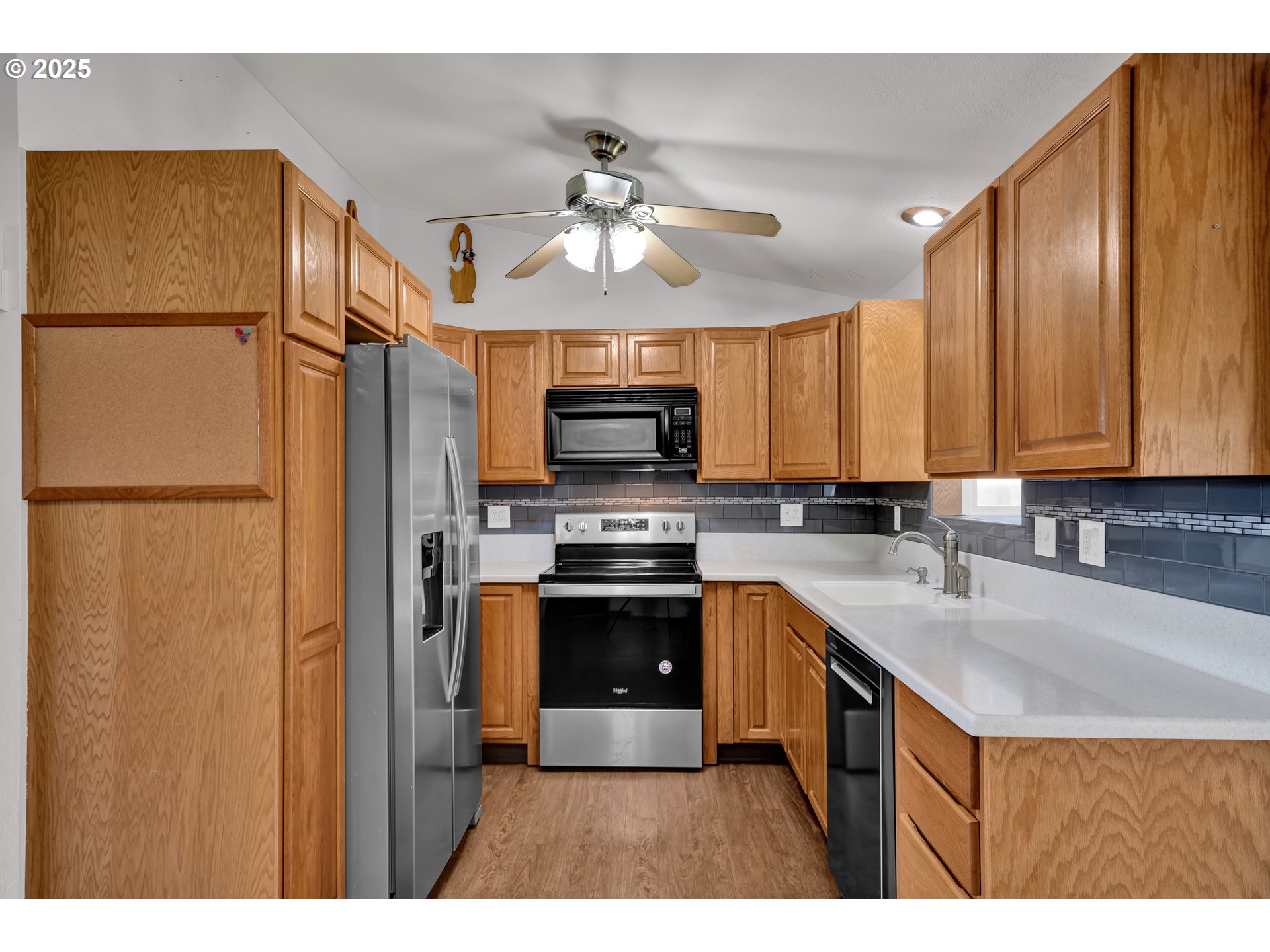 3760 Cherokee Drive Springfield, OR 97478 - Photo 15 of 42 a kitchen with stainless steel appliances granite countertop a refrigerator a sink and dishwasher