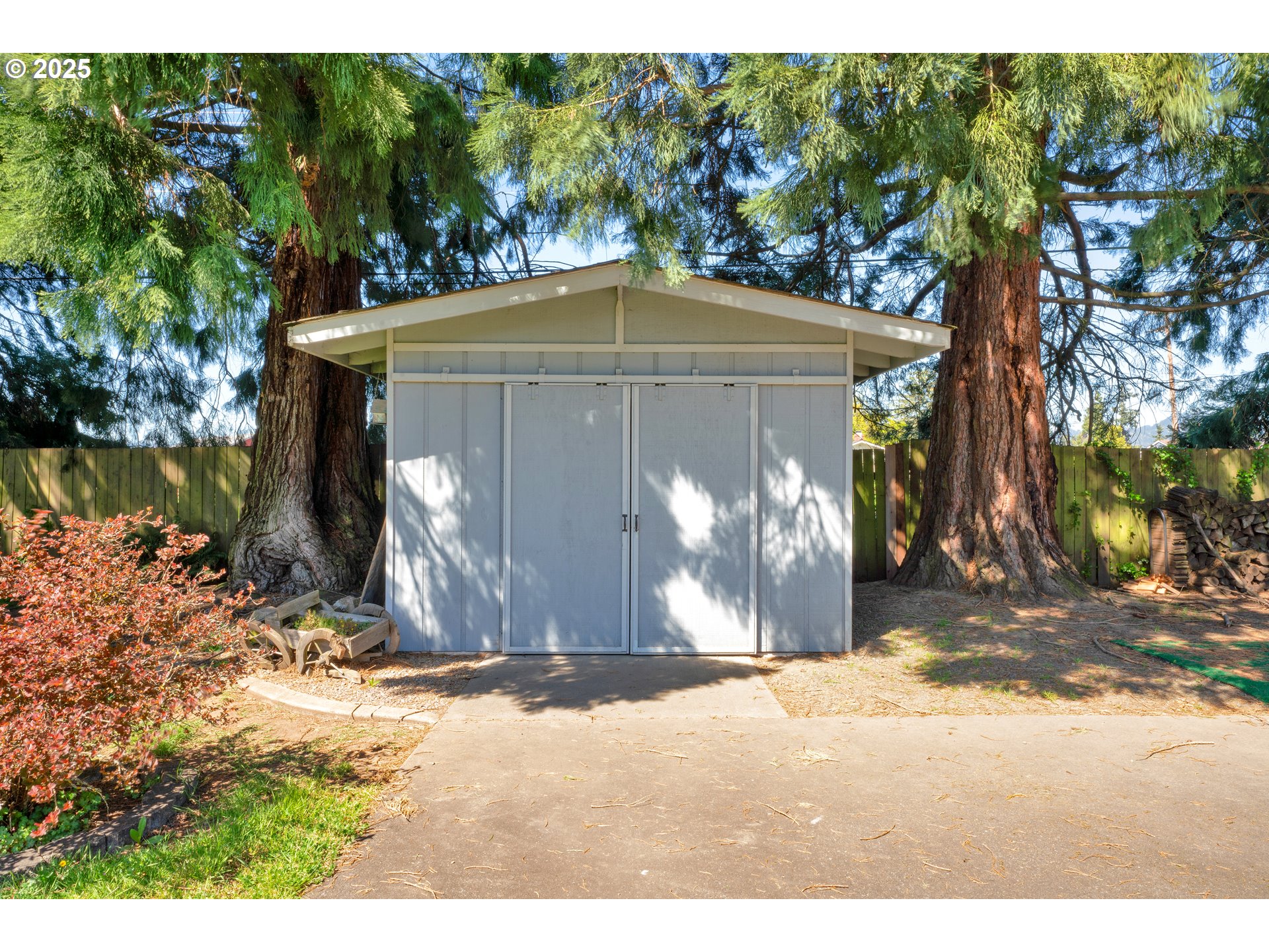 3760 Cherokee Drive Springfield, OR 97478 - Photo 32 of 42 a couple of table and chairs under an umbrella