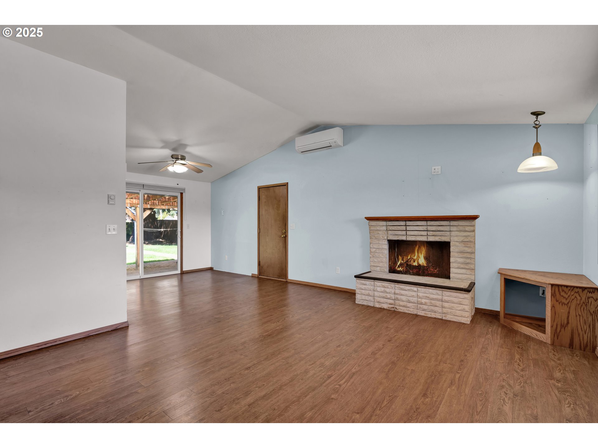 3760 Cherokee Drive Springfield, OR 97478 - Photo 9 of 42 a view of empty room with wooden floor and fireplace