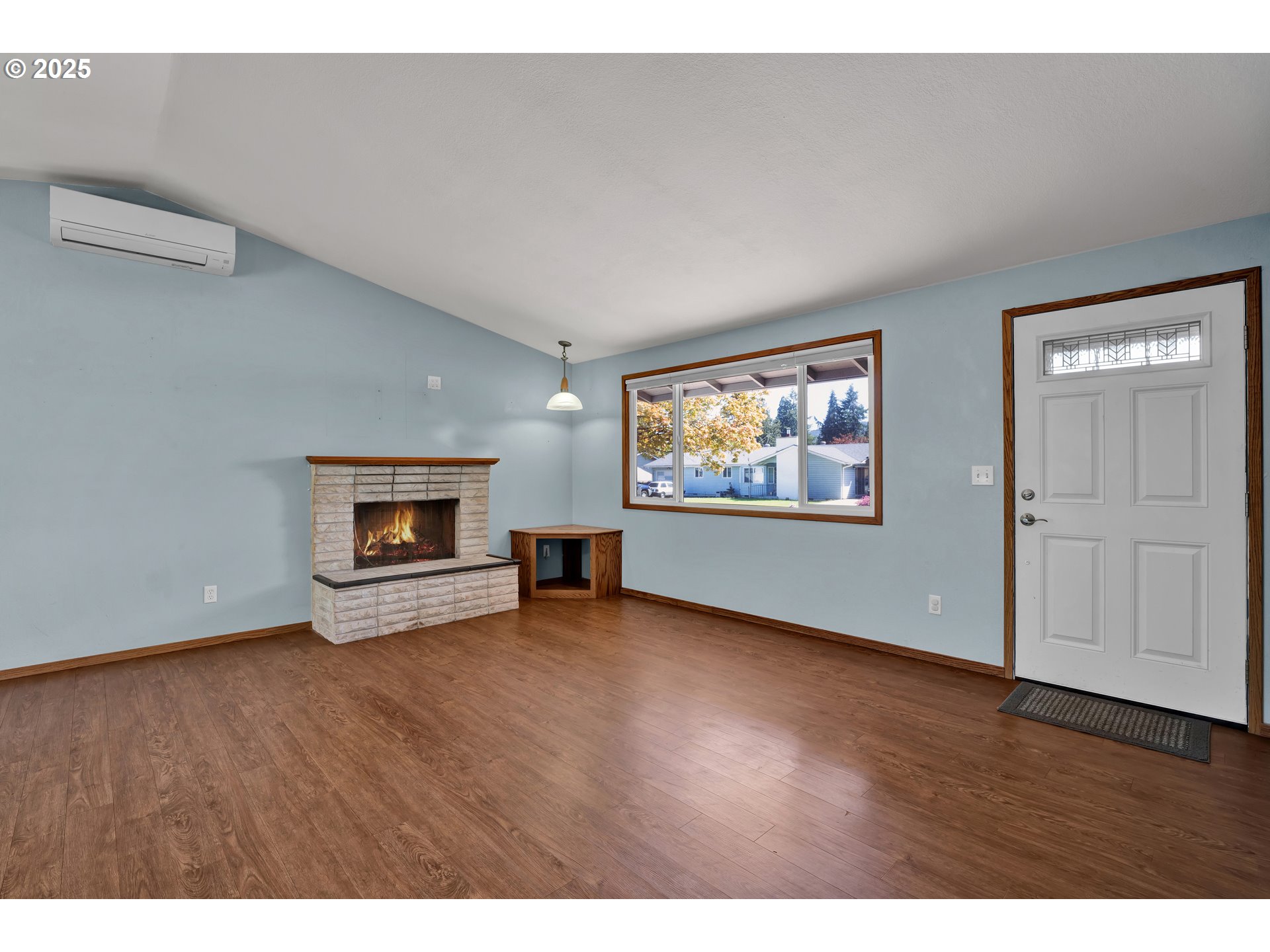 3760 Cherokee Drive Springfield, OR 97478 - Photo 10 of 42 a view of an empty room with a fireplace and a window