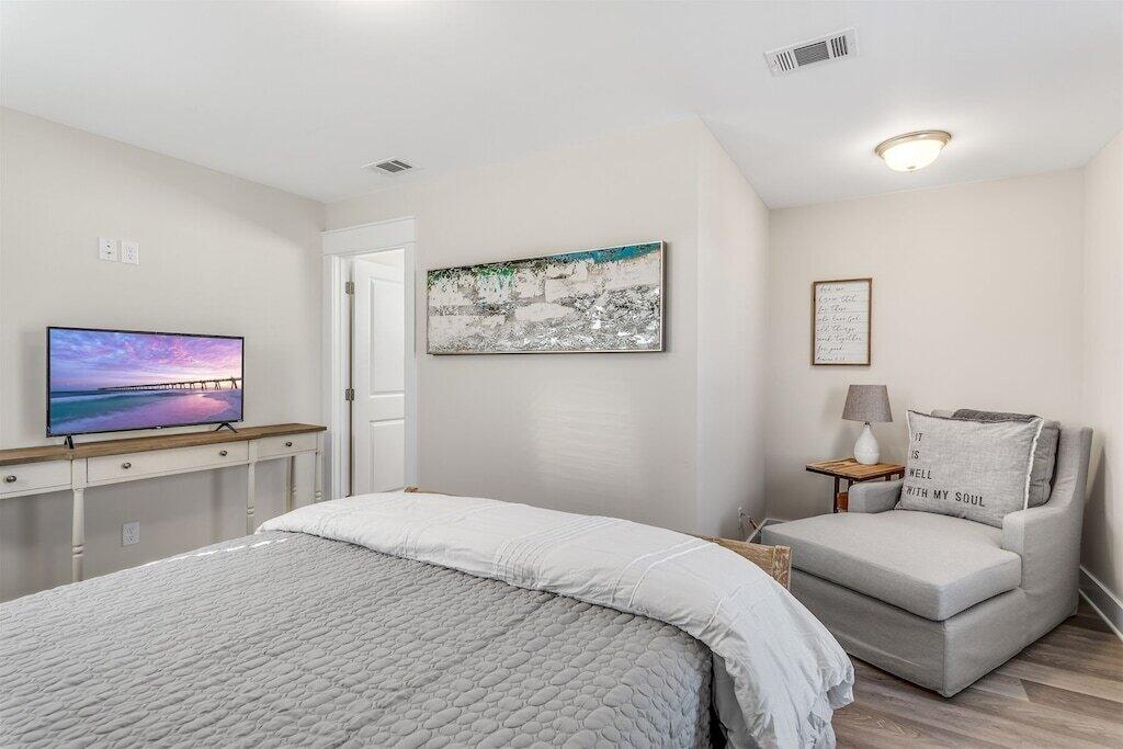 24 Beach View Dr Inlet Beach Inlet Beach, FL 32461 - Photo 18 of 27 a bedroom with a large bed and a couch