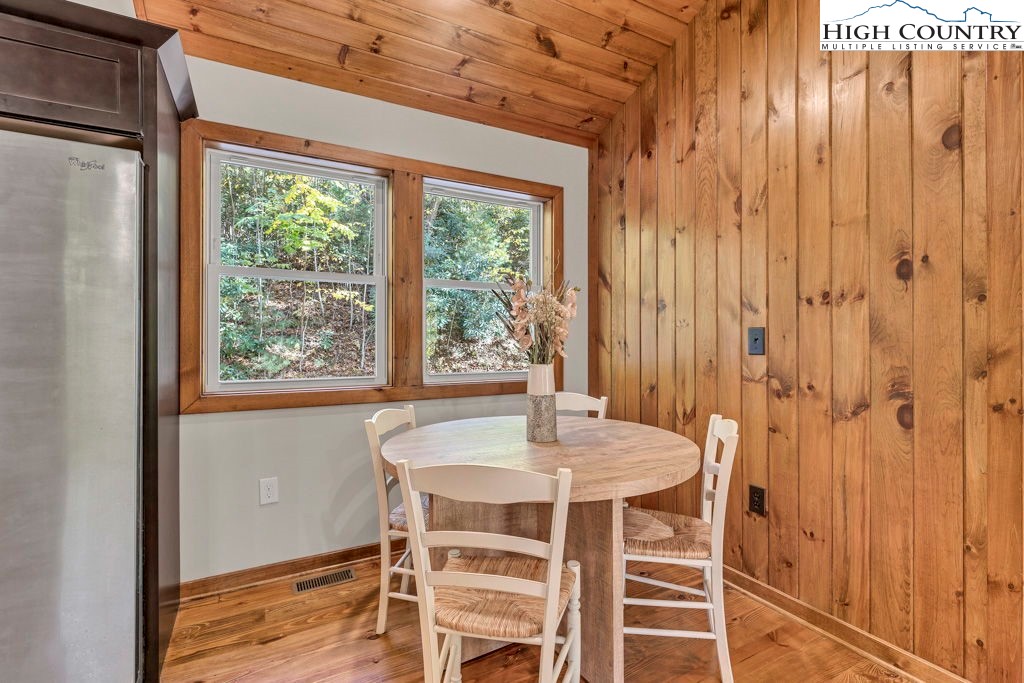 359 Sorrento Falls Road Blowing Rock, NC 28605 - Photo 18 of 46 a dining room with furniture and window