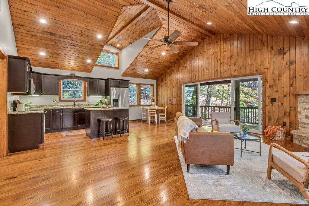 359 Sorrento Falls Road Blowing Rock, NC 28605 - Photo 19 of 46 a living room with stainless steel appliances kitchen island granite countertop furniture wooden floor and a kitchen view