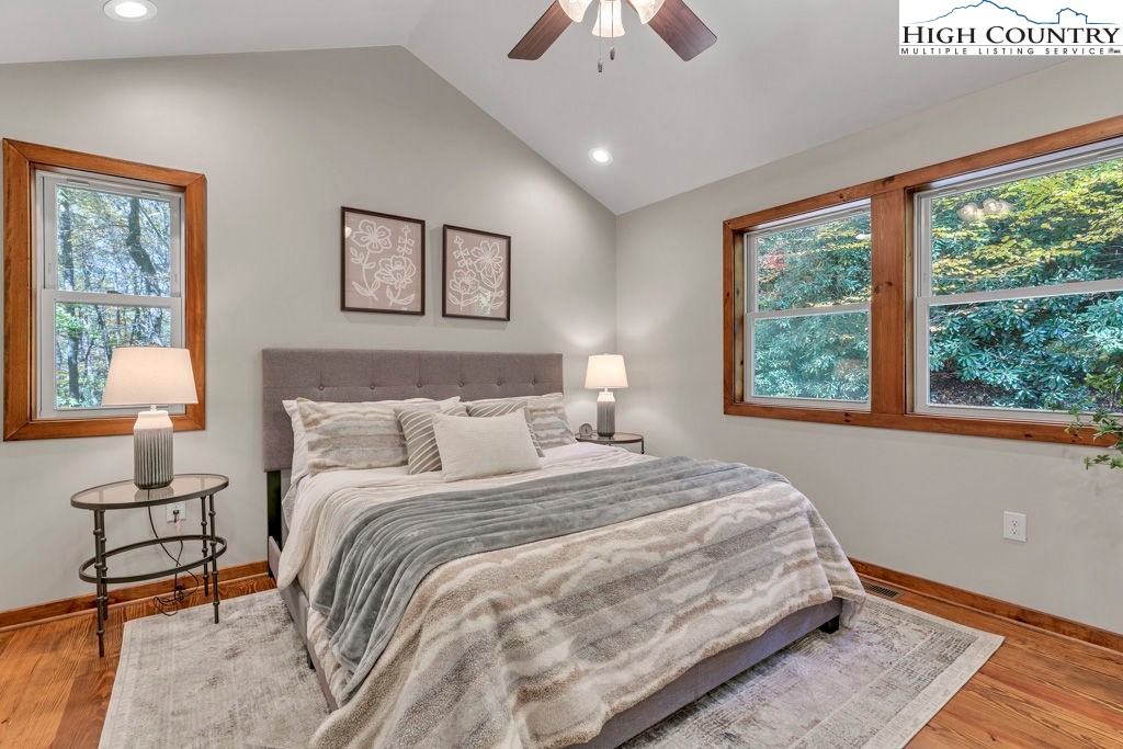 359 Sorrento Falls Road Blowing Rock, NC 28605 - Photo 21 of 46 a bedroom with a bed and a window
