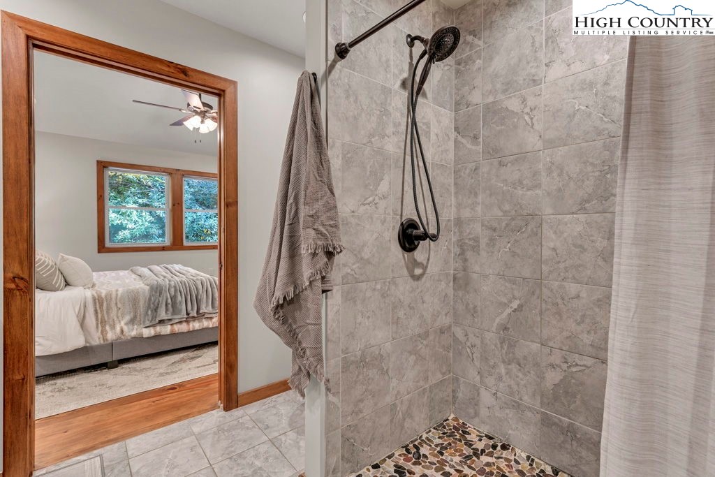 359 Sorrento Falls Road Blowing Rock, NC 28605 - Photo 24 of 46 a en suite bathroom with a shower