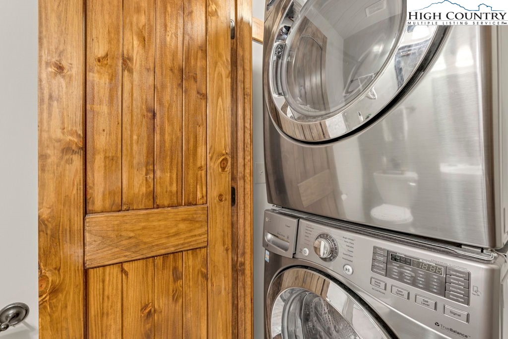 359 Sorrento Falls Road Blowing Rock, NC 28605 - Photo 28 of 46 a utility room with dryer and washer
