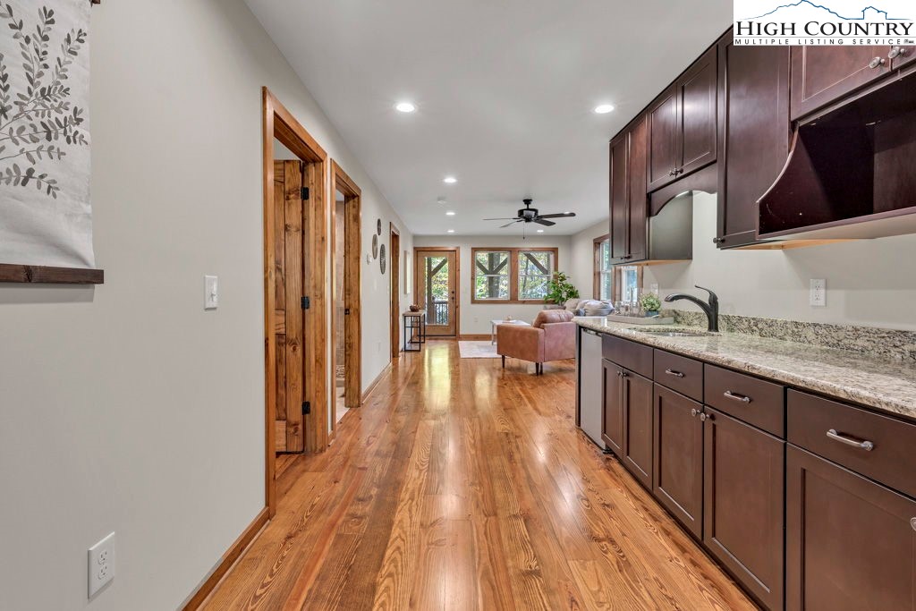 359 Sorrento Falls Road Blowing Rock, NC 28605 - Photo 29 of 46 a spacious bathroom with a granite countertop sink and a wooden floor