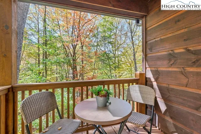 a view of a city from a dining room with large windows